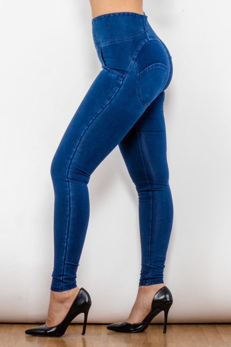 Jeans largos ajustados con cremallera y cintura alta