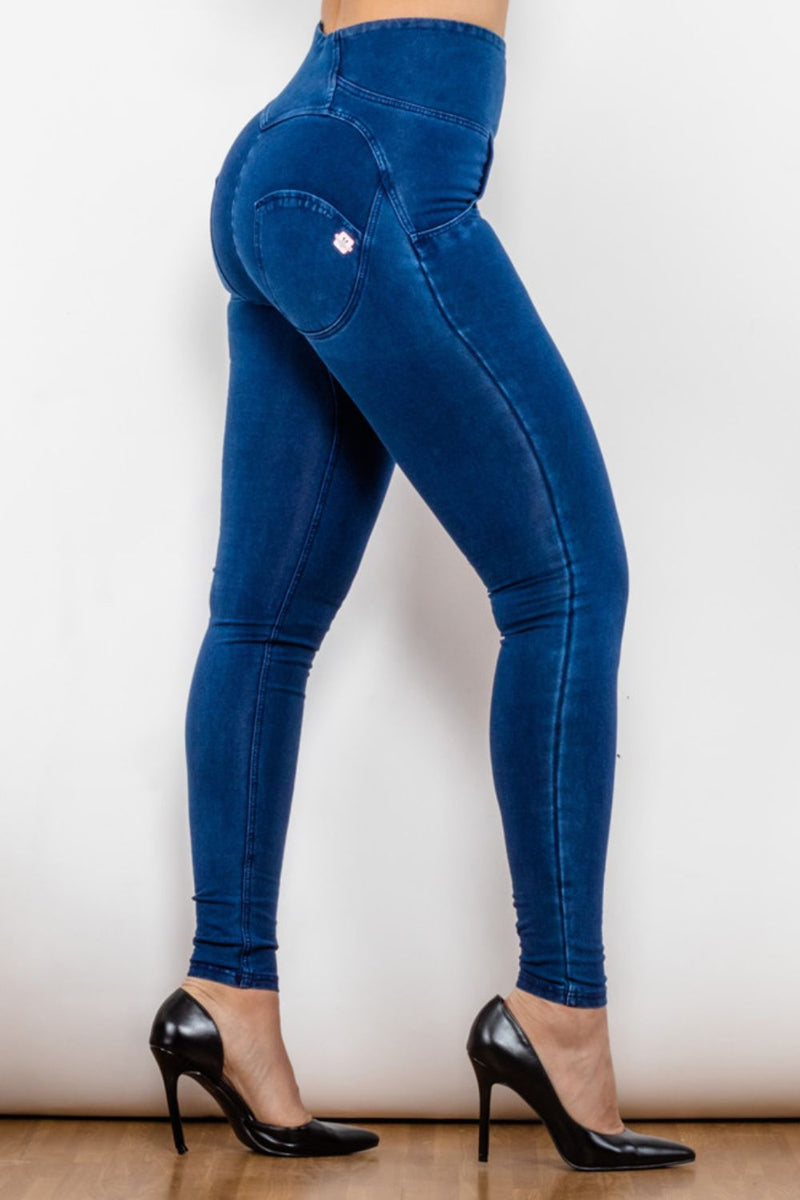 Jeans largos ajustados con cremallera y cintura alta